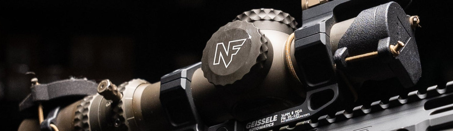 Nightforce ATACR 1-8x24mm F1 in Geissele Super Precision mount with Aimpoint ACRO P2 HexCap red dot cover